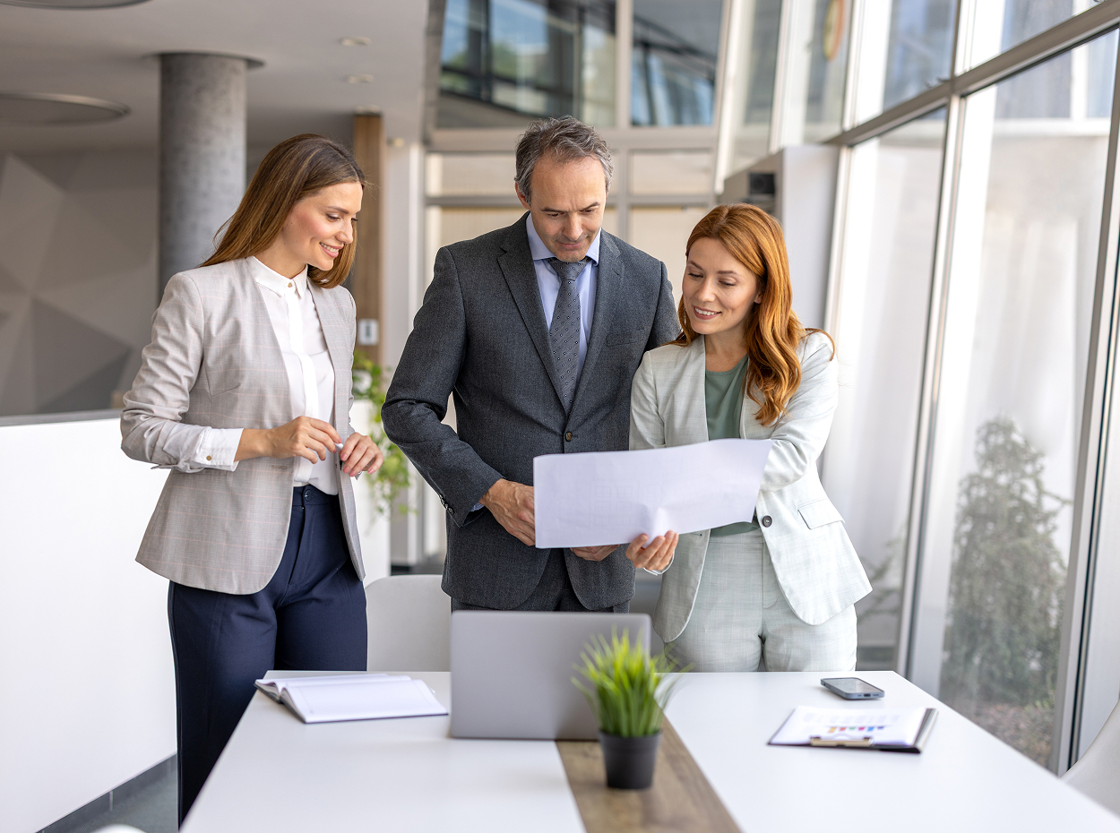 Centralized leasing operations image showing two people dscussing work